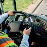 Close up of bus driver at work. Copy space.