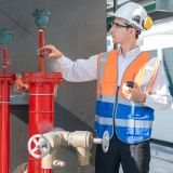 Engineer under checking the industry Fire Protection system