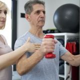 female-physical-therapist-conducts-dumbbell-training-e1702316826673-600x400