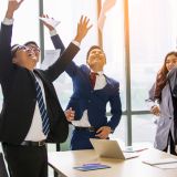young business people putting their hands together. Stack of hands. Unity, teamwork concept