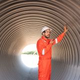 Mechanical engineer wearing safety uniform checking and inspection pipeline system new construction project of industrial.