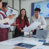 Professionals analyzing data charts during a strategic planning meeting