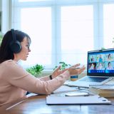 Woman teacher in headphones teaching online, high school students on laptop computer screen, video conference. Remote meeting, consultation, e lesson, training, education, technology concept