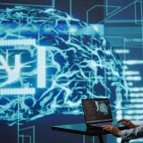 AI computer scientist using laptop for business data analysis in high tech workspace. Close up shot of Indian woman working on notebook to automatize tasks using artificial intelligence, camera B
