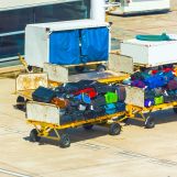 baggage-in-the-trailer-at-the-airport-santiago-c-2026-03-26-07-49-30-utc