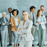 Group of young business people having a meeting or presentation and seminar standing in the office. Portrait of a young business woman talking